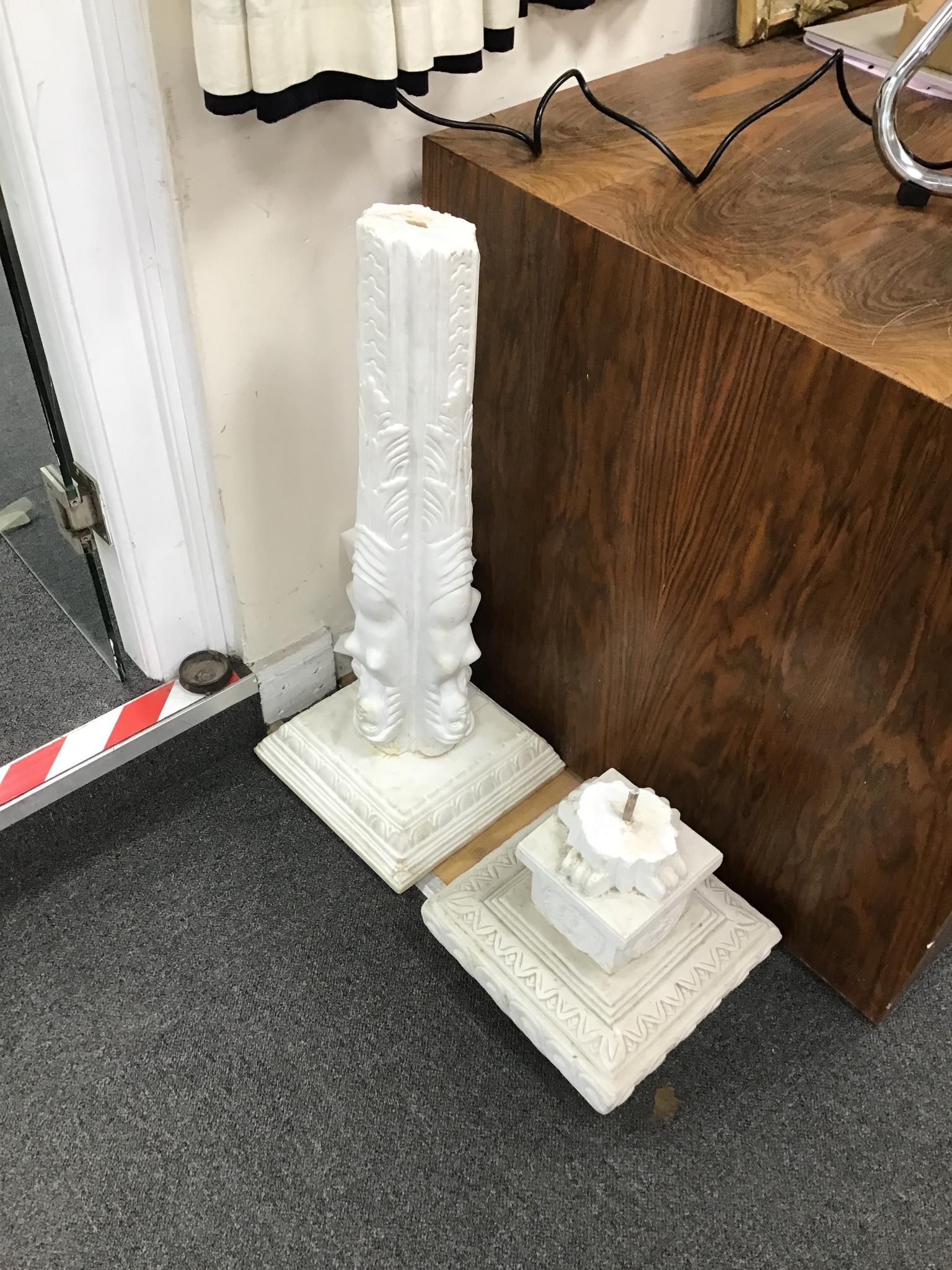 A pair of carved white marble pedestals, one in need of restoration, height 101cm